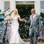 married couple celebrating on the front steps at Owston Hall Hotel Doncaster